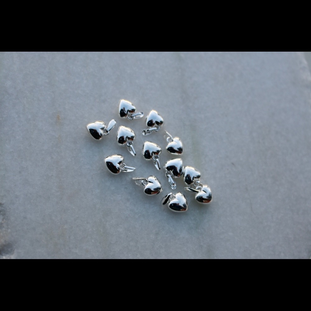Tiny silver heart charms
